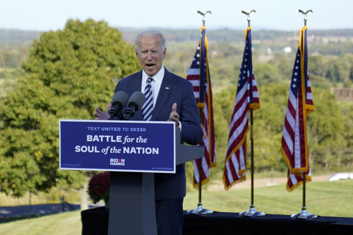 Joe Biden speaks at Gettysburg National Military Park in Pennsylvania with the sign: "Battle for the soul of the nation."