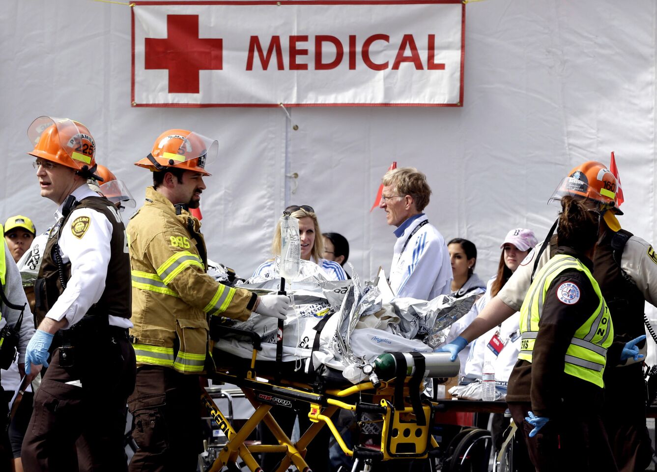 Medical personnel work outside the medical tent in the aftermath of two blasts near the finish line of the Boston Marathon.
