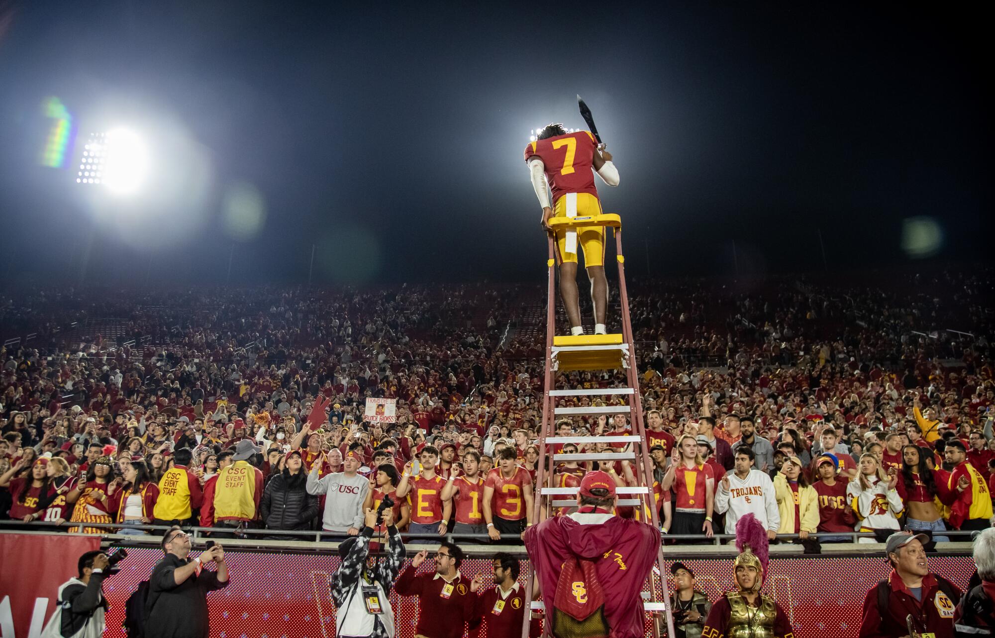 USC defensive back Calen Bullock directs the band with a sword after beating Notre Dame