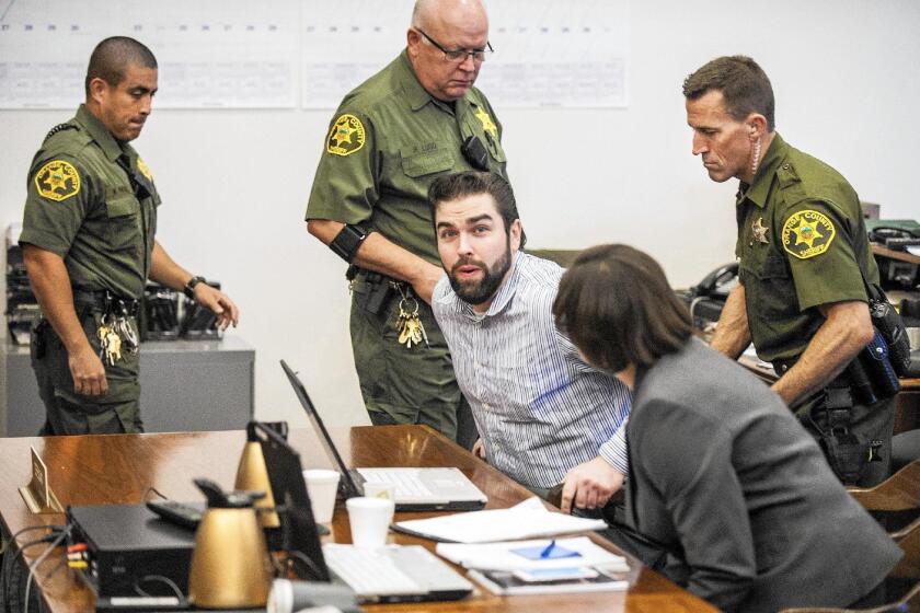 Orange County Sheriff deputies seat Daniel Wozniak in Superior Court in Santa Ana Friday morning for his sentencing. Wozniak was convicted in the killing of two people to bankroll his wedding and honeymoon.