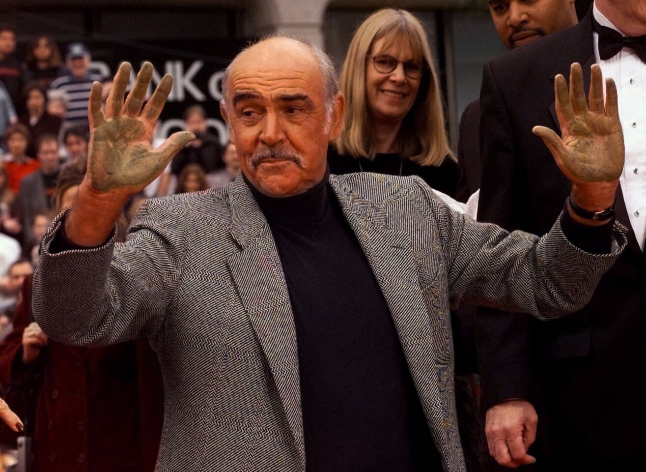 Connery shows his hands after placing his handprints in cement outside Grauman's Chinese Theatre on April 13, 1999.