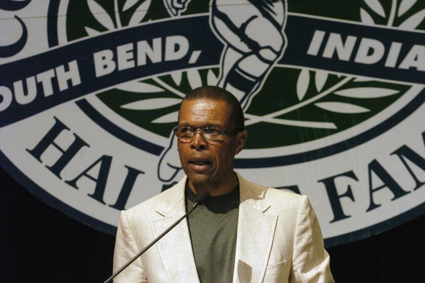 Gale Sayers speaks at a College Football Hall of Fame event June 2, 2004.
