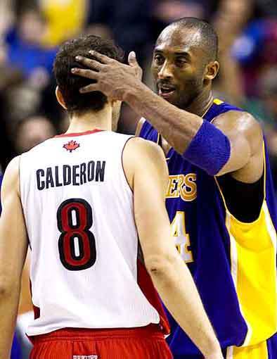 Lakers guard Kobe Bryant consoles Raptors point guard Jose Calderon after defeating Toronto, 94-92, on Sunday.