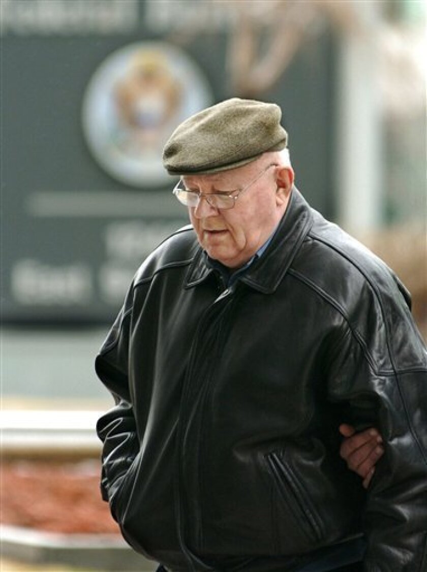 FILE - In this Monday, Feb. 28, 2005 file photo, John Demjanjuk arrives at the federal building in Cleveland for an immigration hearing. U.S. immigration officers are ready to make another attempt to deport John Demjanjuk, an 89-year-old Ohio man sought in Germany to answer in court for an alleged past as a guard at a Nazi death camp _ the latest episode in a complex 32-year case linking him to World War II atrocities. (AP Photo/Mark Duncan, File)