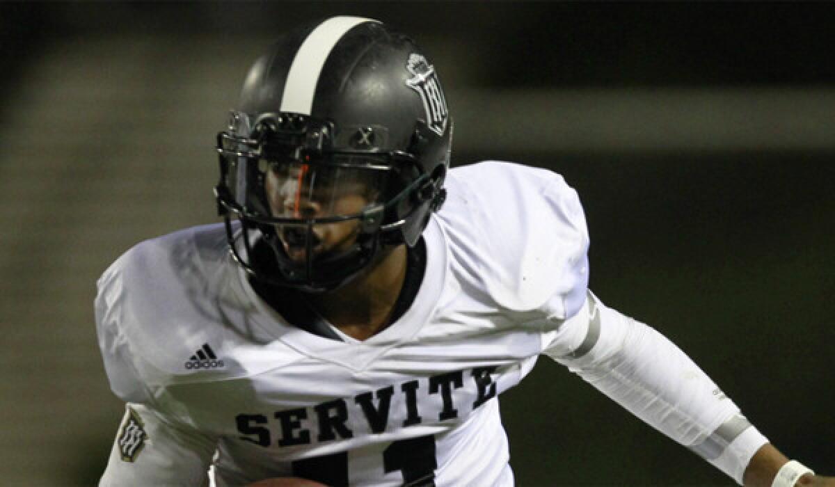 Servite quarterback Travis Waller, shown playing Edison last month, had a frustrating night Saturday during a 35-10 loss to Concord De La Salle.