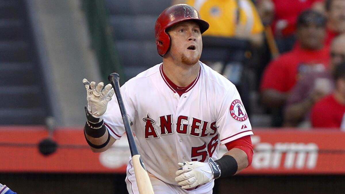 Angels right fielder Kole Calhoun watches his two-run home run clear the fence during the fourth inning of the team's 5-2 win over the Texas Rangers on Sunday.