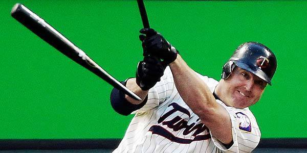 Minnesota Twins' Jim Thome breaks his bat as he flies out during the fourth inning in Game 2 of the American League division series against the New York Yankees in Minneapolis.