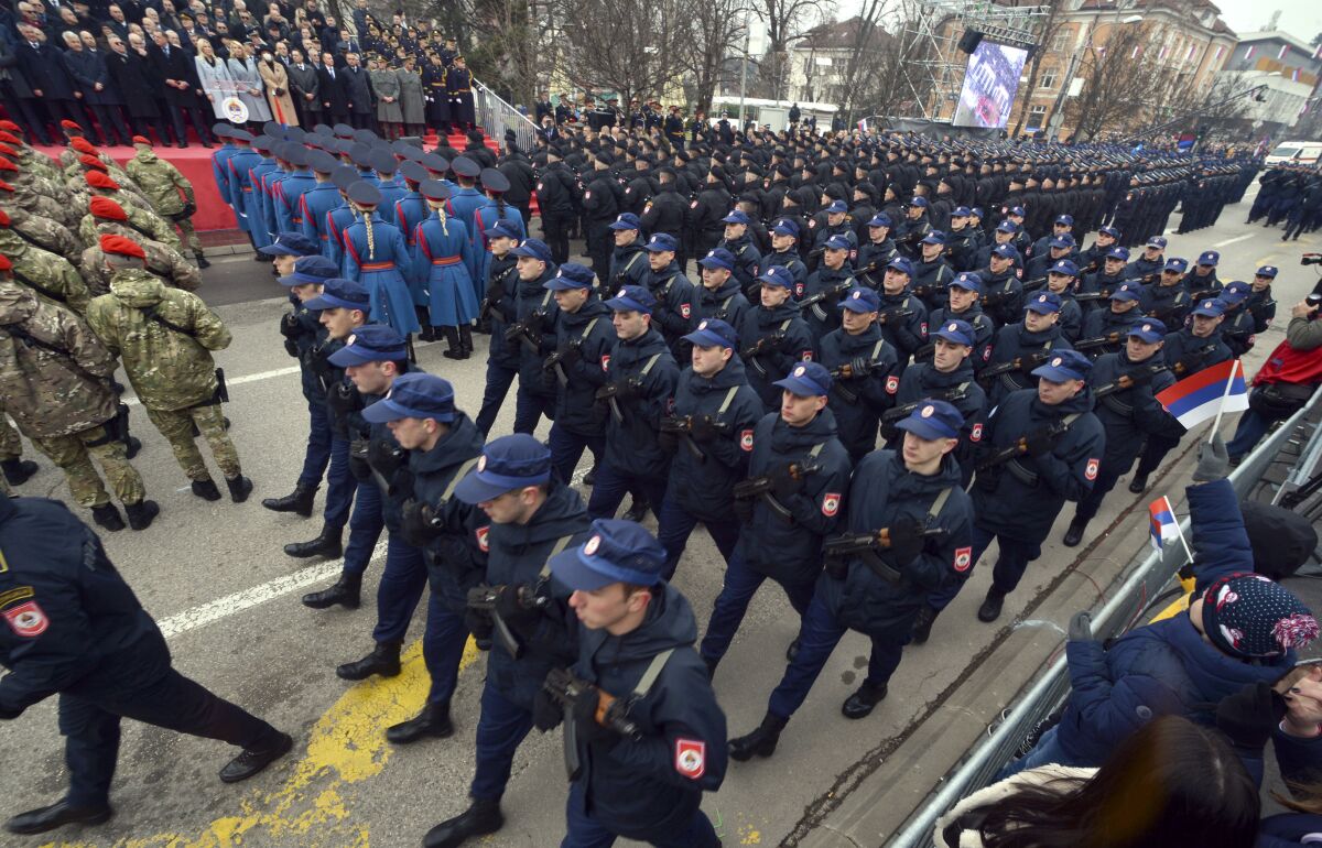 Members of the police forces of Republic of Srpska march during a parade marking the 30th anniversary of the Republic of Srpska in Banja Luka, northern Bosnia, Sunday, Jan. 9, 2022. This week Bosnian Serb political leader Milorad Dodik was slapped with new U.S. sanctions for alleged corruption. Dodik maintains the West is punishing him for championing the rights of ethnic Serbs in Bosnia — a dysfunctional country of 3.3 million that's never truly recovered from a fratricidal war in the 1990s that became a byname for ethnic cleansing and genocide. (AP Photo/Radivoje Pavicic)
