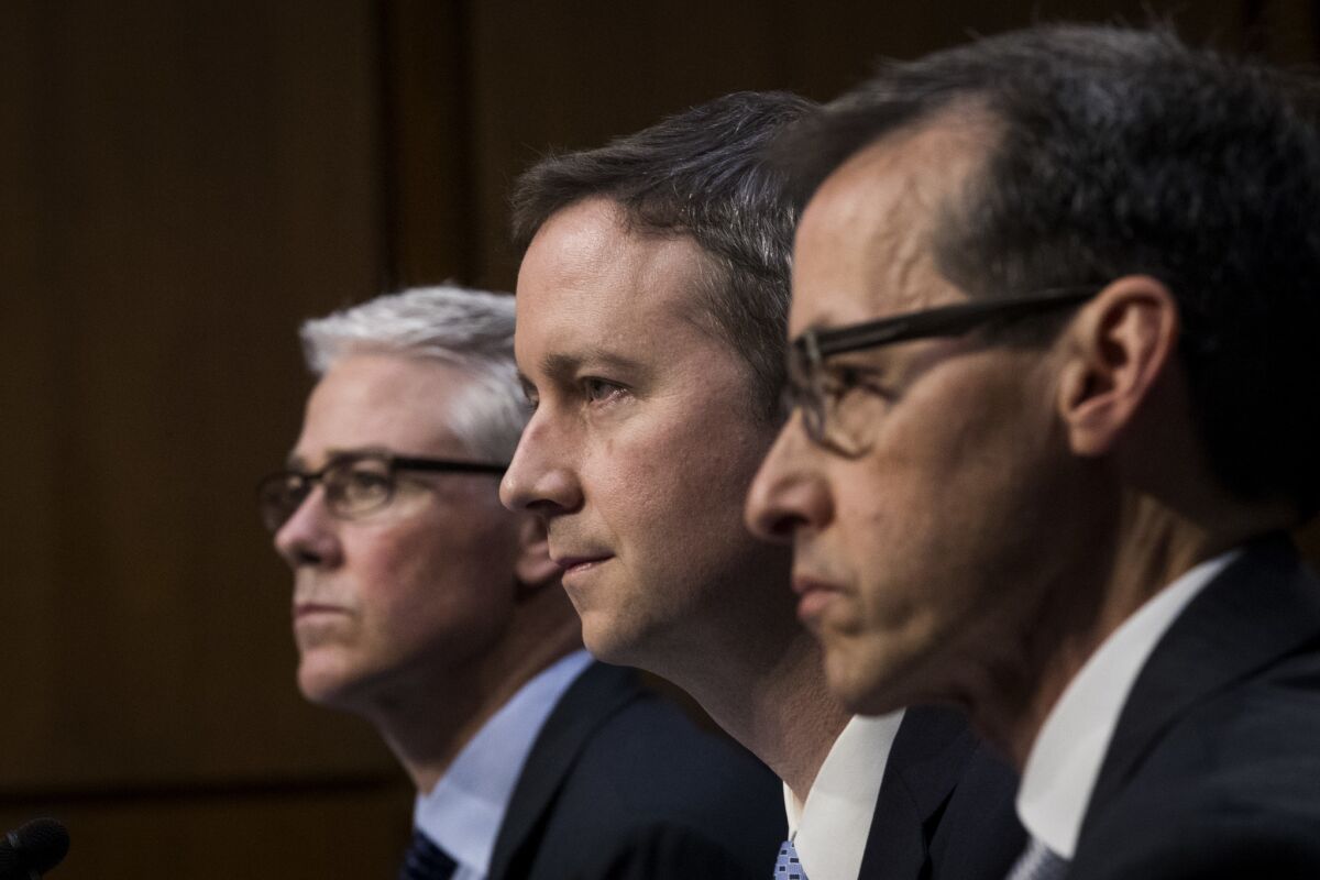 Colin Stretch, general counsel at Facebook, left, Sean Edgett, acting general counsel at Twitter, and Richard Salgado, director of law enforcement and information security at Google, testify before a Senate panel.