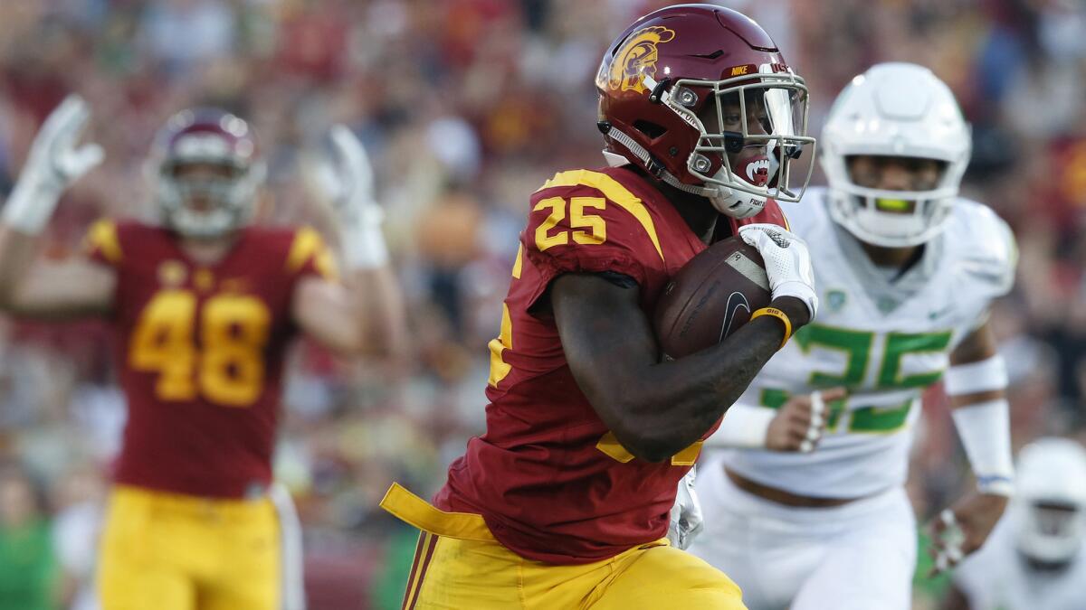 USC running back Ronald Jones II scores the first of four touchdowns against Oregon during a game Nov. 5 at the Coliseum.