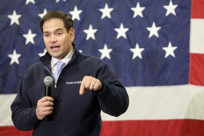 Sen. Marco Rubio, shown campaigning in Iowa for the Republican presidential nomination, has placed a hold on Roberta Jacobson's nomination as U.S. ambassador to Mexico, a legislative maneuver that blocks a confirmation vote.