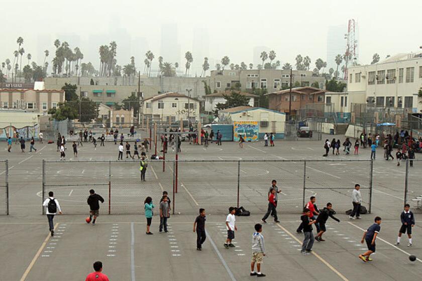 Children play on the blacktop during recess at Berendo Middle School in October. Several buildings at the school are on the seismic inventory list.