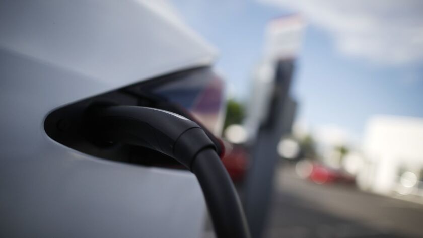 About 15,000 San Diego Gas & Electric customers are receiving $500 credits on their utility bills after signing up for an electric vehicle credit offered by the state.