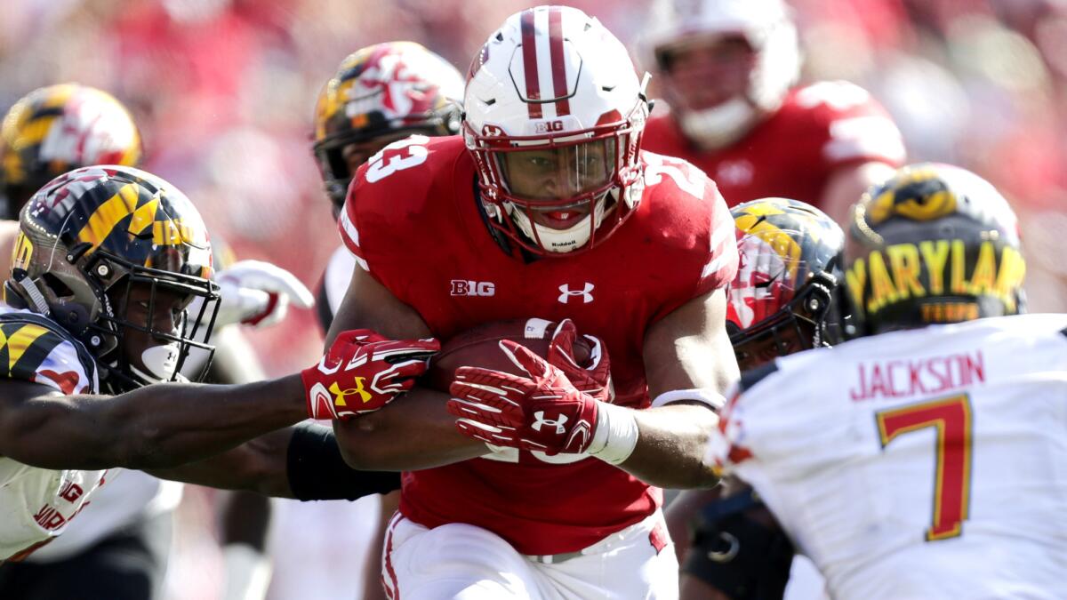 Wisconsin running back Jonathan Taylor bursts into the secondary against the Maryland defense during the second half Saturday.