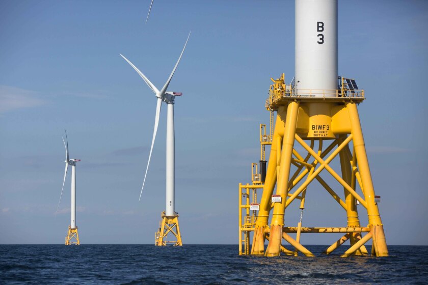 FILE - This photo from Aug. 15, 2016, shows offshore wind turbines near Block Island, R.I. The Biden administration said Wednesday it will hold its first offshore wind auction next month, offering nearly 500,000 acres off the coast of New York and New Jersey for wind energy projects that could produce enough electricity to power nearly 2 million homes. (AP Photo/Michael Dwyer, File)
