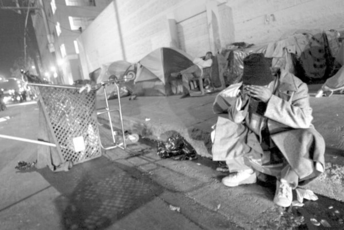 Homeless live on the streets of skid row. The city may file another appeal of ban on seizing and destroying property that homeless people leave unattended.