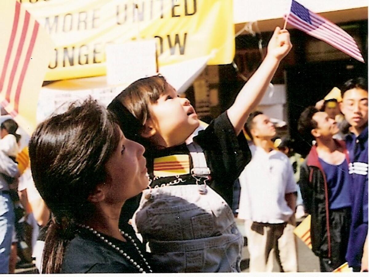 In 1999. Annie Wright, left, took her daughter, Lacy Lew Nguyen Wright, to a protest in Little Saigon