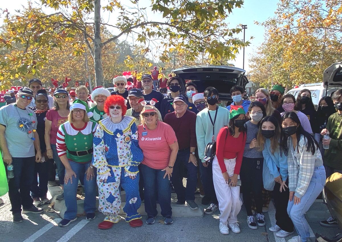 Vista Kiwanians distributed 2,500 donated books to children along the city’s holiday parade route.