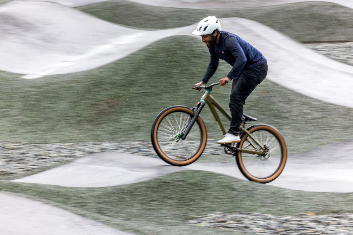 Eliot Jackson, a professional mountain biker, shows off his skills at the Inglewood Pumptrack.