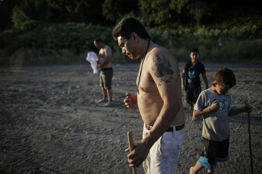 WEITCHPEC, CA, MONDAY, JUNE 6, 2016 - Loren Twofeathers Offield pauses while coaching the Yurok tribe's stick team. (Robert Gauthier/Los Angeles Times)