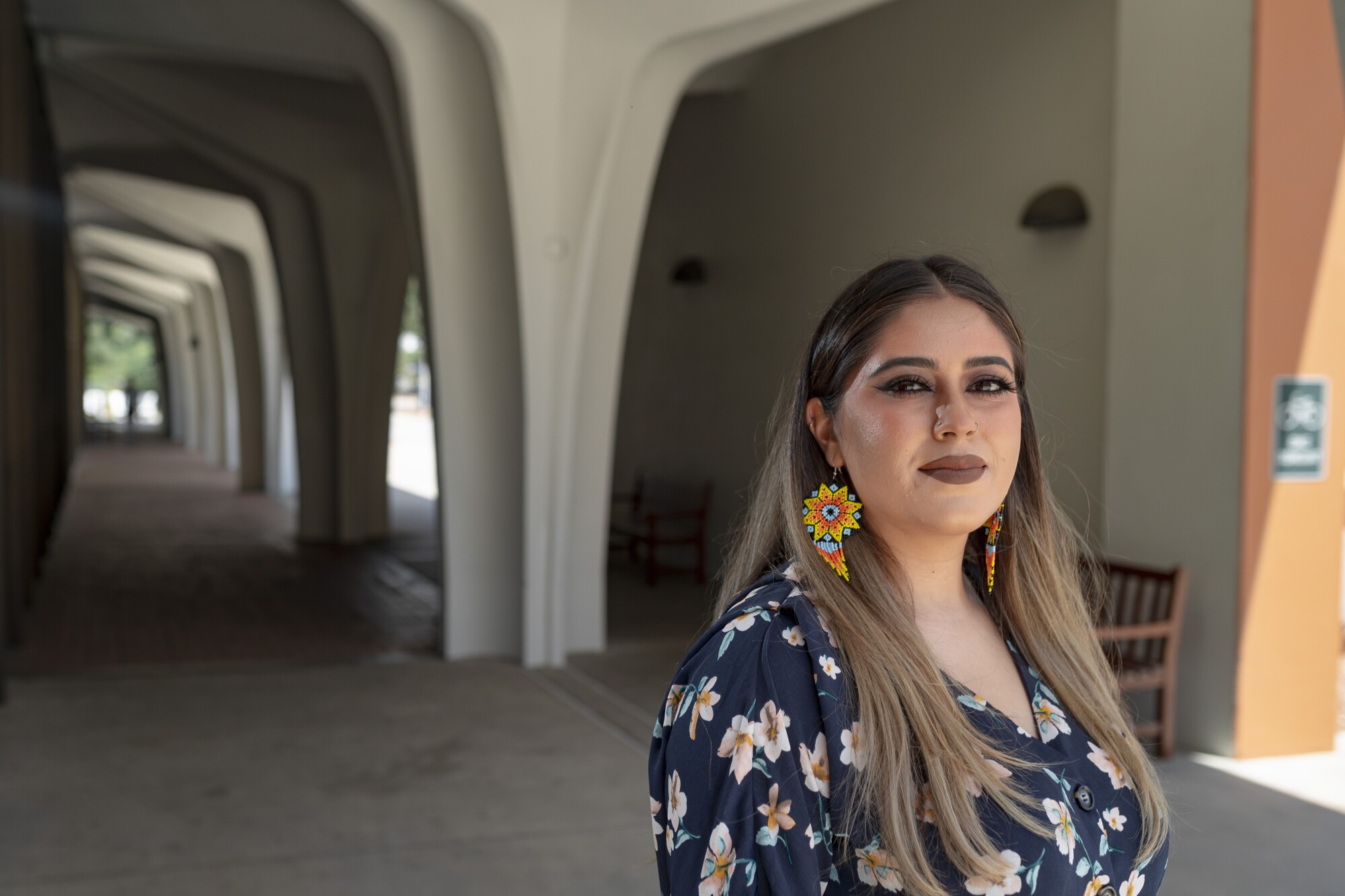 Daisy Gomez-Fuentes stands outside of Cal State Fullerton's library
