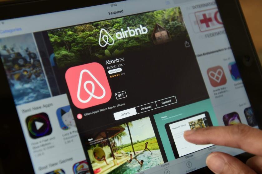 (FILES) This file photo taken on April 28, 2016 shows a woman browsing the site of US home sharing giant Airbnb on a tablet in Berlin. A Berlin court on June 8, 2016 began hearing a challenge brought by four individuals against the German capital's authorities over their ban on private holiday rentals. / AFP PHOTO / John MACDOUGALLJOHN MACDOUGALL/AFP/Getty Images ** OUTS - ELSENT, FPG, CM - OUTS * NM, PH, VA if sourced by CT, LA or MoD **