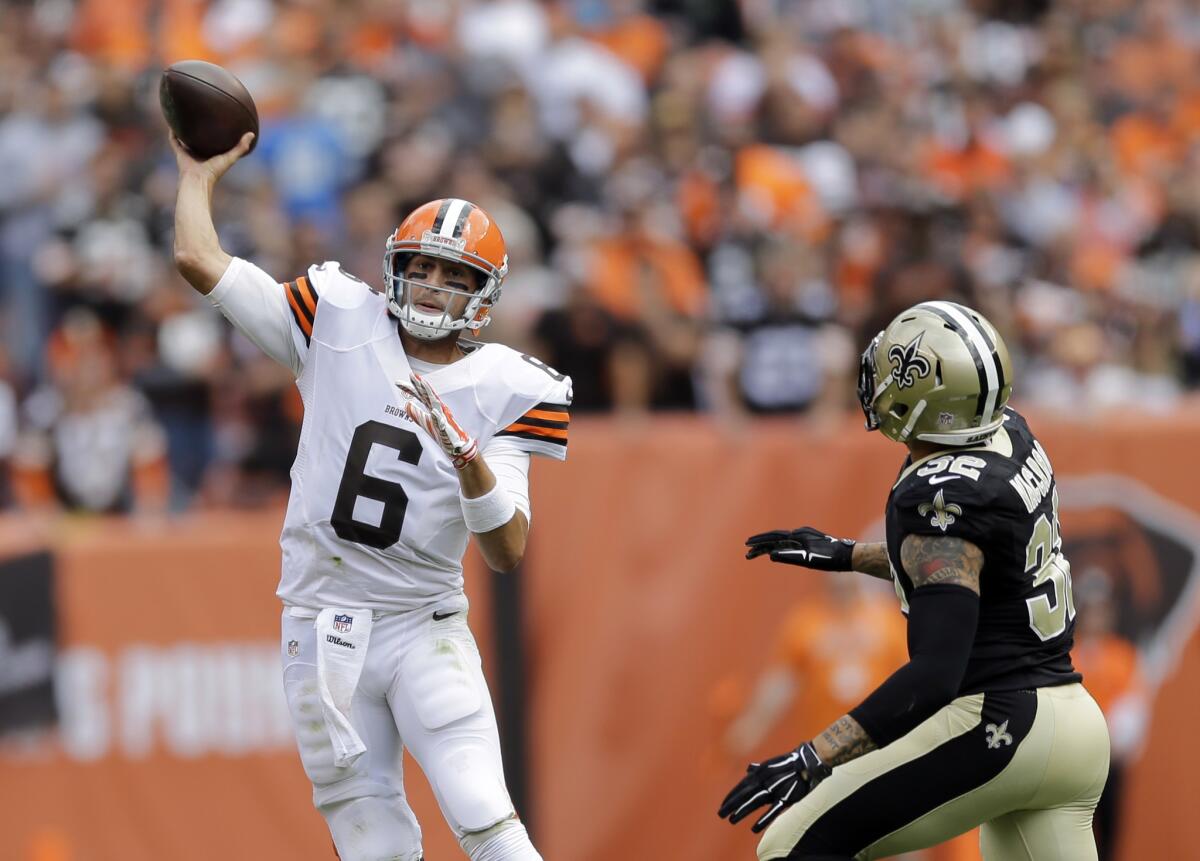 Cleveland Browns quarterback Brian Hoyer throws under pressure from New Orleans Saints strong safety Kenny Vaccaro.