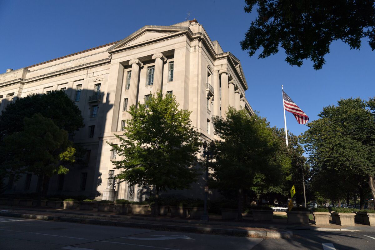 The American flag flies outside the Justice Department building