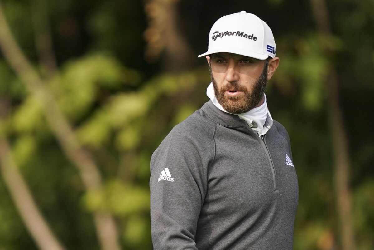 Dustin Johnson walks the 12th fairway during practice before the U.S. Open Championship golf tournament at Winged Foot Golf Club, Tuesday, Sept. 15, 2020, in Mamaroneck, N.Y. (AP Photo/John Minchillo)