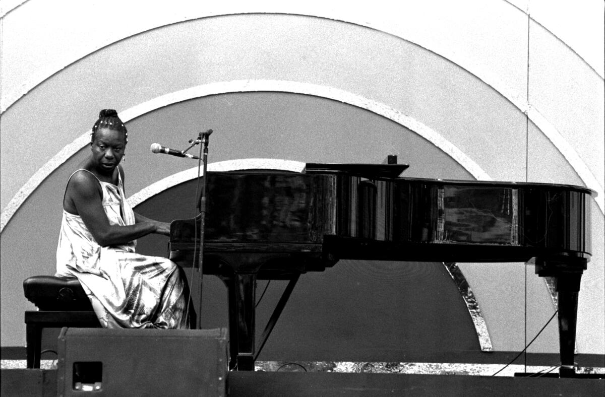 A woman plays the piano.