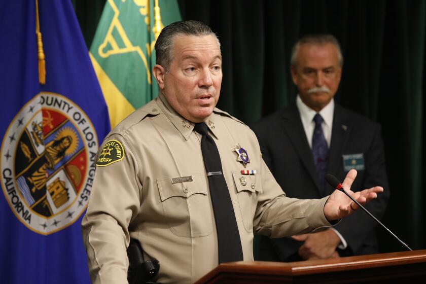 LOS ANGELES, CA - SEPTEMBER 30: Los Angeles County Sheriff Alex Villanueva and Homicide Bureau Captain Kent A. Wegener, right, announce an arrest of Deonte Lee Murray in the ambush shooting of two on-duty deputies who were sitting in their marked patrol car at the Metro Blue Line station in Compton September 12, 2020. Hall Of Justice on Wednesday, Sept. 30, 2020 in Los Angeles, CA. (Al Seib / Los Angeles Times