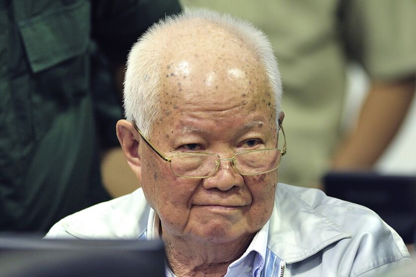 FILE - Khieu Samphan, former Khmer Rouge head of state, sits in a court during a hearing at the U.N.-backed war crimes tribunal in Phnom Penh, Cambodia on Nov. 16, 2018. Samphan, who was convicted by a U.N.-backed tribunal of genocide, crimes against humanity and war crimes for his role as a leader of the communist Khmer Rouge when they ruled Cambodia in 1975-1979, has been transferred from the tribunal's jail to serve his life sentence at a Cambodian state prison. (Mark Peters/Extraordinary Chambers in the Courts of Cambodia via AP, File)