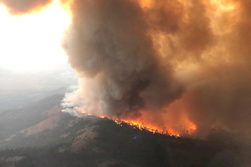 This Saturday, Sept. 4, 2021, aerial photo provided by the U.S. Forest Service Lassen National Forest shows the Great Basin Team 1 Air Attack operations on Saturday on the Dixie Fire on the Horton Ridge in Plumas County, Calif. (Great Basin Team 1 Air Attack Operations/U.S. Forest Service via AP)