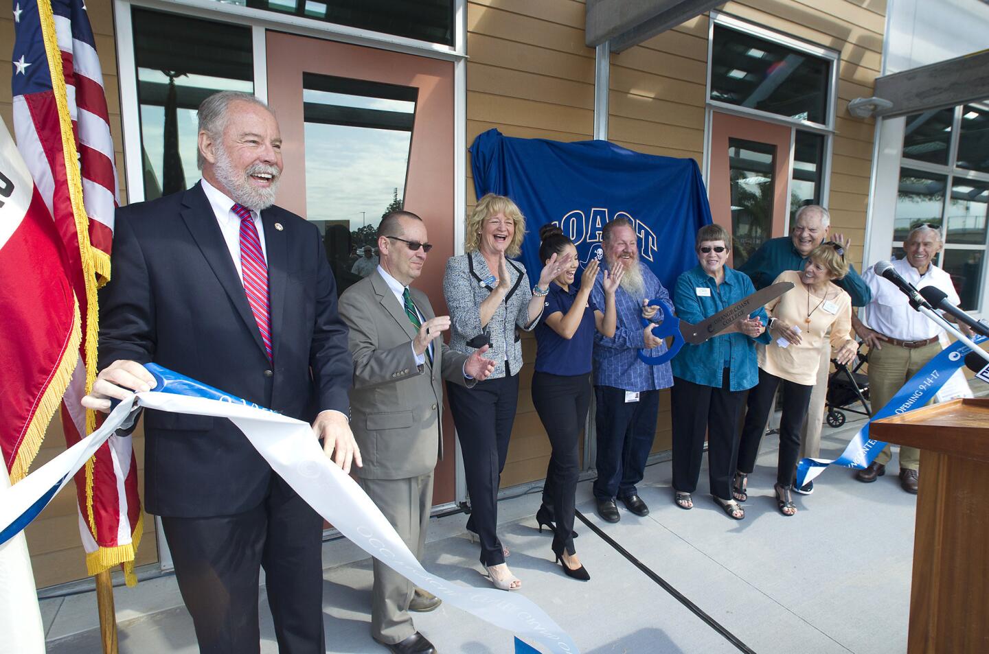 City and school officials including OCC President Dennis Harkins, left, and Costa Mesa Mayor Katrina Foley, third from left, celebrate the new OCC Recycling Center with a dedication and ribbon-cutting ceremony at the new center on Thursday.