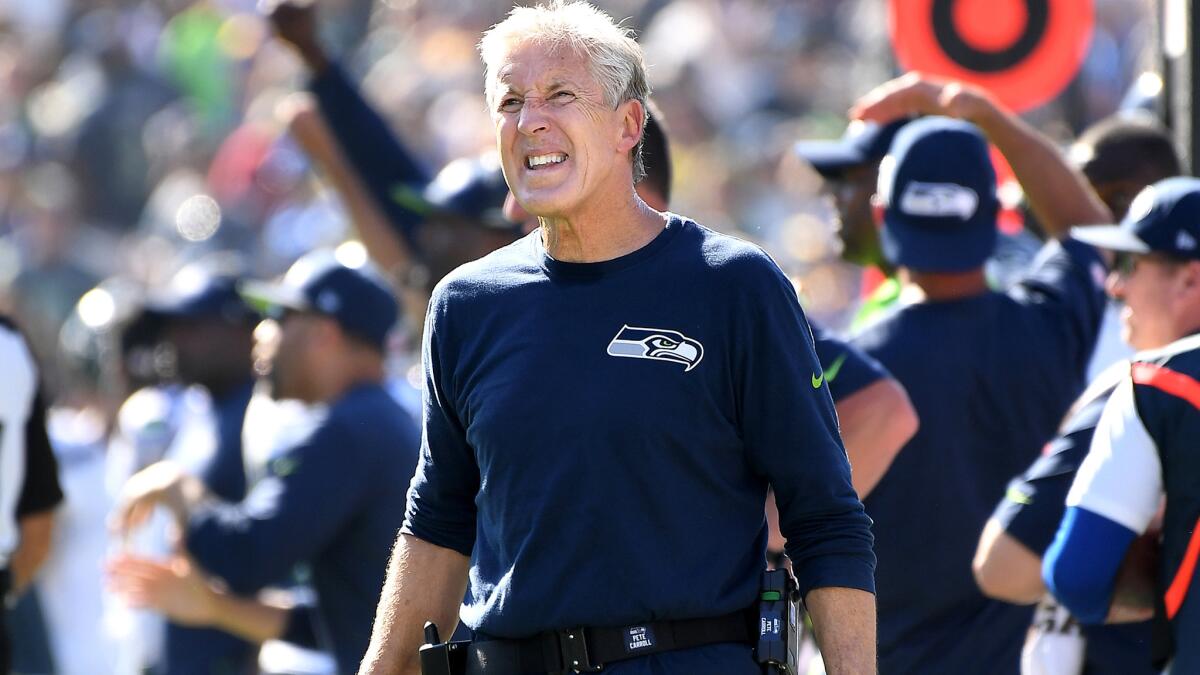 Coach Pete Carroll reacts to a penalty against the Seahawks on Sunday at the Coliseum.