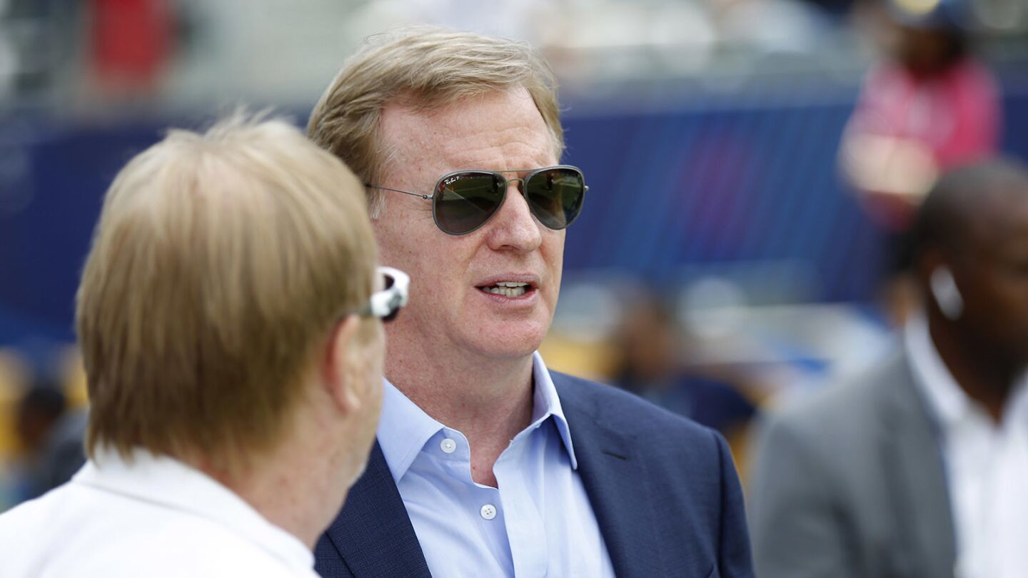 Roger Goodell, Commissioner of the NFL, talks with Oakland Raiders owner Mark Davis before a game against the Los Angeles Chargers at the StubHub Center in Carson on Oct. 7, 2018. (Photo by K.C. Alfred/San Diego Union-Tribune)