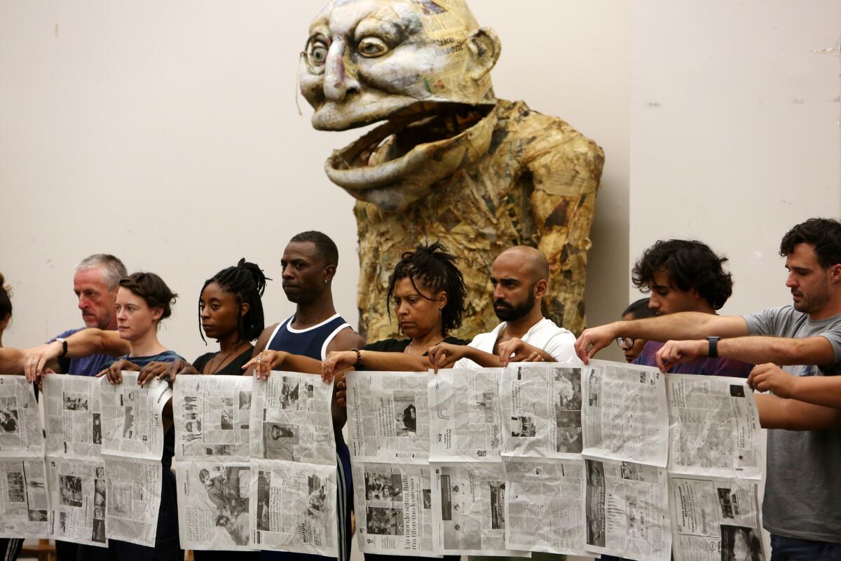 The cast of the opera "Satyagraha" rehearses at the Dorothy Chandler Pavilion in downtown Los Angeles.