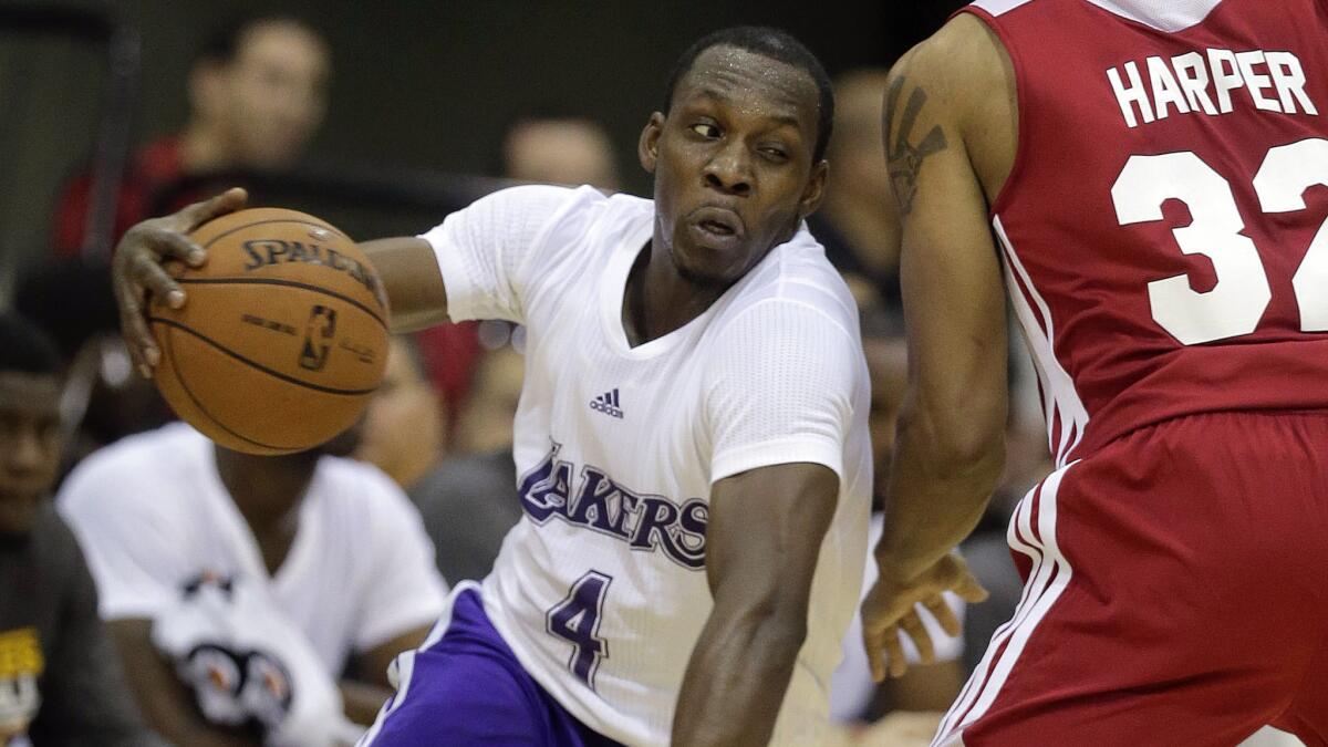 Lakers guard Lester Hudson drives around Cleveland Cavaliers forward Justin Harper during an NBA Summer League game in Las Vegas in July 2013. Hudson signed with the Clippers on Sunday.