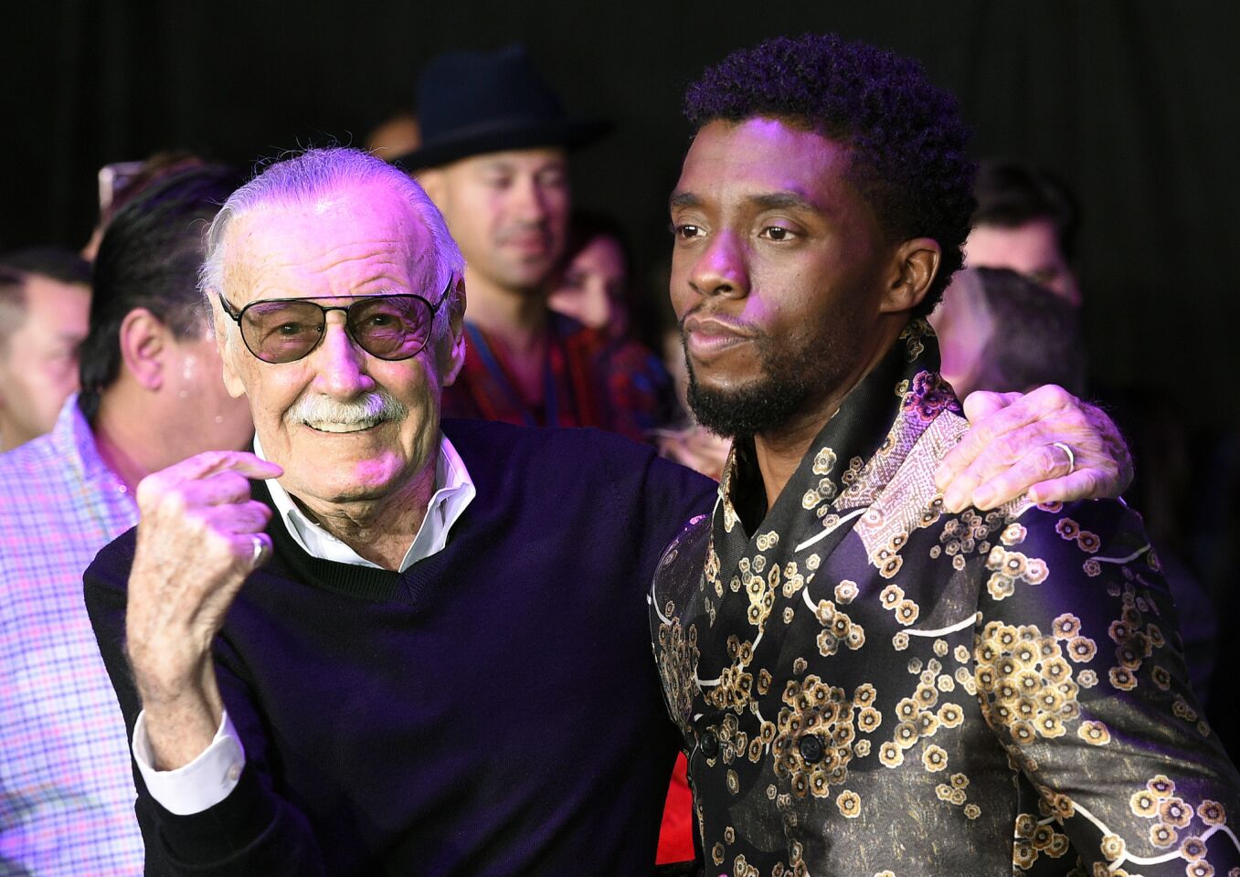Comic book legend Stan Lee, left, co-creator of the Black Panther superhero, poses with Chadwick Boseman at the "Black Panther" premiere on Jan. 29, 2018, in Los Angeles.