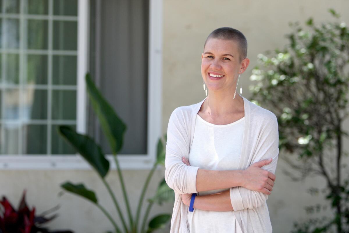 Joanna Peresie with a shaved head at her Burbank home on Thursday, June 16, 2016. Peresie promised to cut her hair if her children raised more than $1,000 at a lemonade stand/bake sale fundraiser for a nephew from Virginia who was recently diagnosed with leukemia. Her children raised $3,400.
