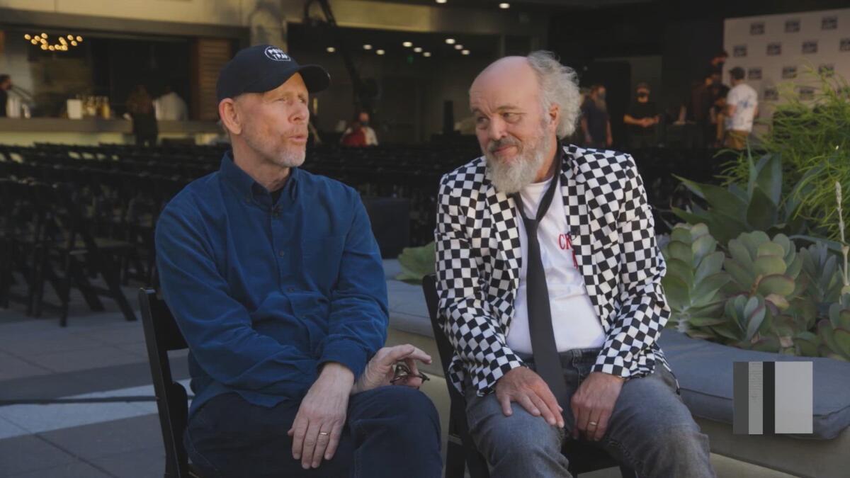 Ron Howard (left) and Clint Howard chat before book club night.