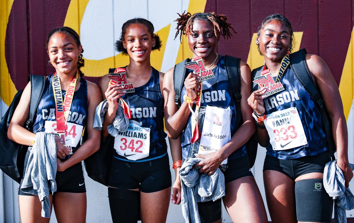 Carson High sprinters Christine Gray, left, Kaitlyn Williams, Reign Redmond and TaAhjah Fann pose for a photo.
