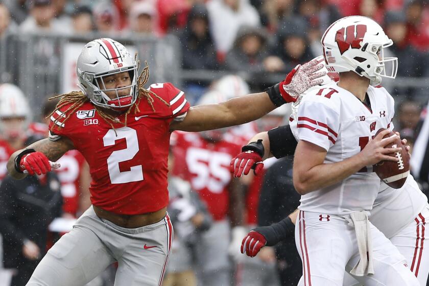 Ohio State Buckeyes defensive end Chase Young (2) pressures Wisconsin Badgers quarterback Jack Coan (17) during the second quarter of the NCAA football game at Ohio Stadium in Columbus, Ohio on Saturday, Oct. 26, 2019. (Adam Cairns/The Columbus Dispatch/TNS) ** OUTS - ELSENT, FPG, TCN - OUTS **