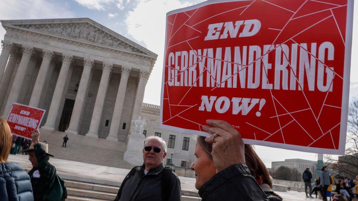 Protesters rally outside as Justices hear arguments in the Maryland Gerrymandering case, at the Supreme Court in Washington on March 28.