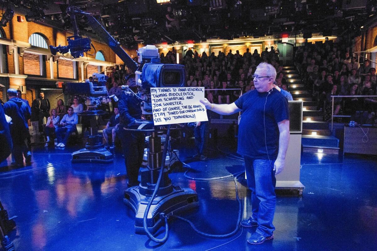 Wally Feresten holds a cue card on "Late Night With Seth Meyers" on May 14, 2015.