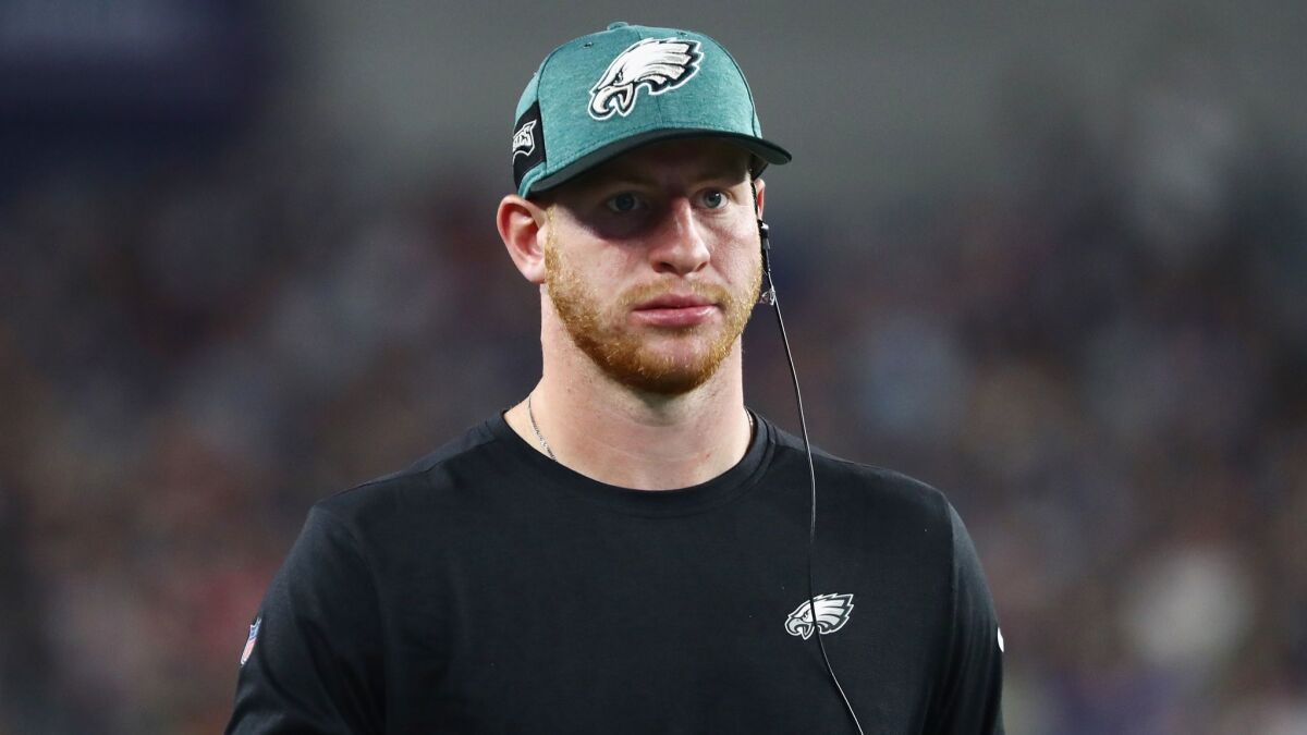 Eagles quarterback Carson Wentz looks on from the sidelines during a preseason game against the New England Patriots.