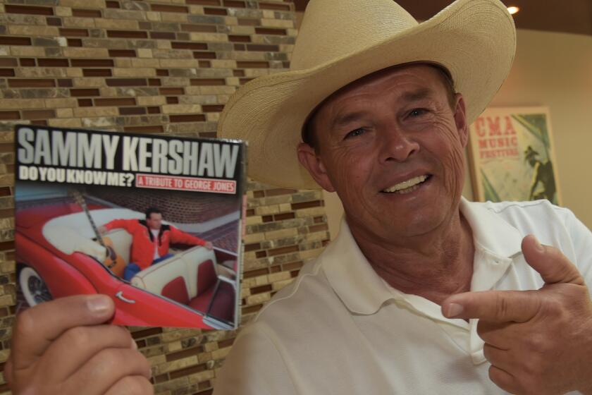 Sammy Kershaw holds his album "Do You Know Me? A Tribute to George Jones."