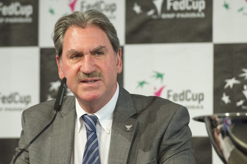 FILE - International Tennis Federation President David Haggerty speaks at the draw of the World Group Semifinal Fed Cup matches, in Lucerne, Switzerland, Friday, April 15, 2016. A member of the U.S. Olympic and Paralympic Committee’s board of directors is among those pushing the IOC’s call for behind-the-scenes negotiations to ensure the wellbeing of tennis player Peng Shuai. ITF president David Haggerty, whose position on the USOPC board helped him also receive a spot on the International Olympic Committee, told BBC that the ITF does not “want to punish a billion people” to resolve Peng’s case. (Urs Flueeler/Keystone via AP, File)