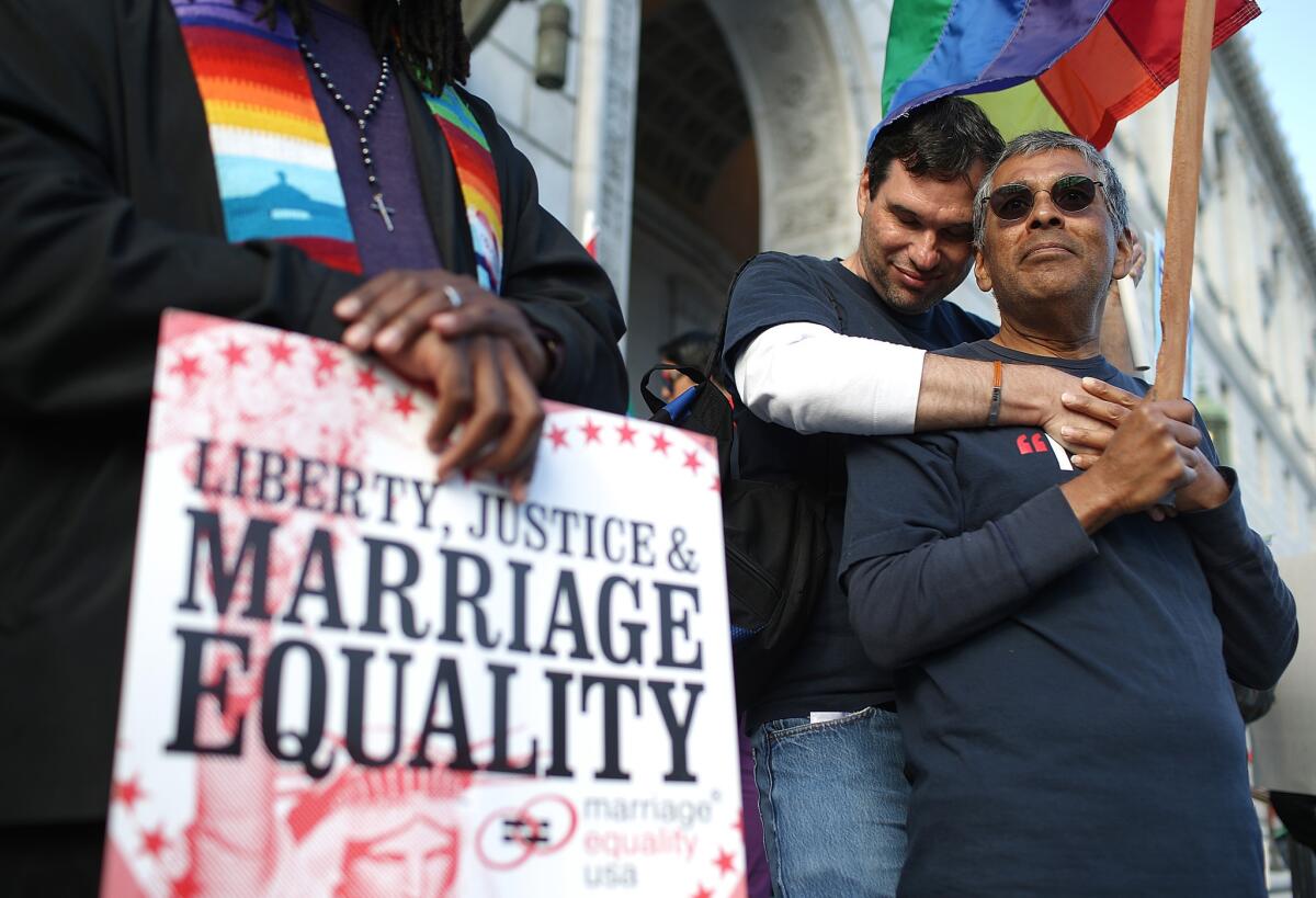 Supporters of same-sex marriage held a vigil after the U.S. Supreme Court heard arguments on Proposition 8, the controversial ballot initiative that defines marriage as between a man and a woman.