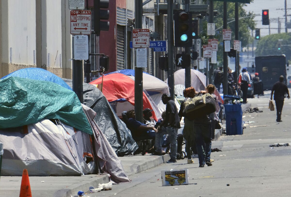Tents housing the homeless line a street in downtown Los Angeles. 